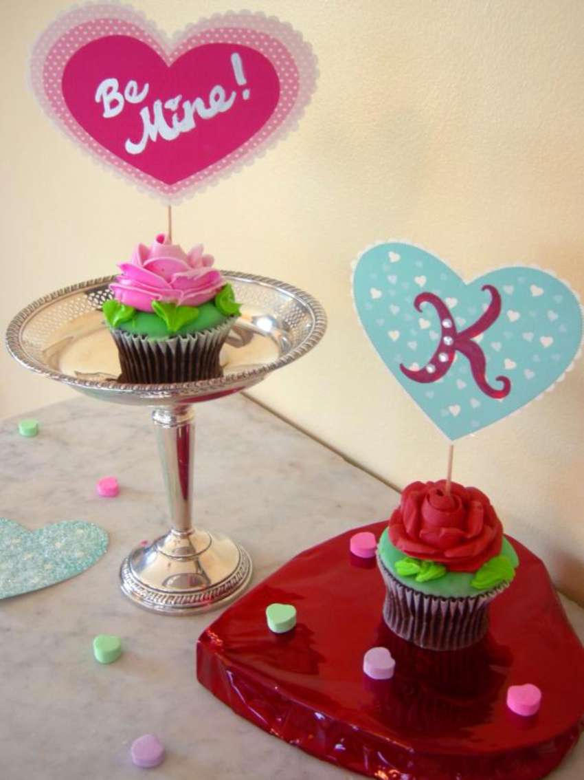 A box of cupcakes with adorable toppers are perfect for the date! Source: HGTV